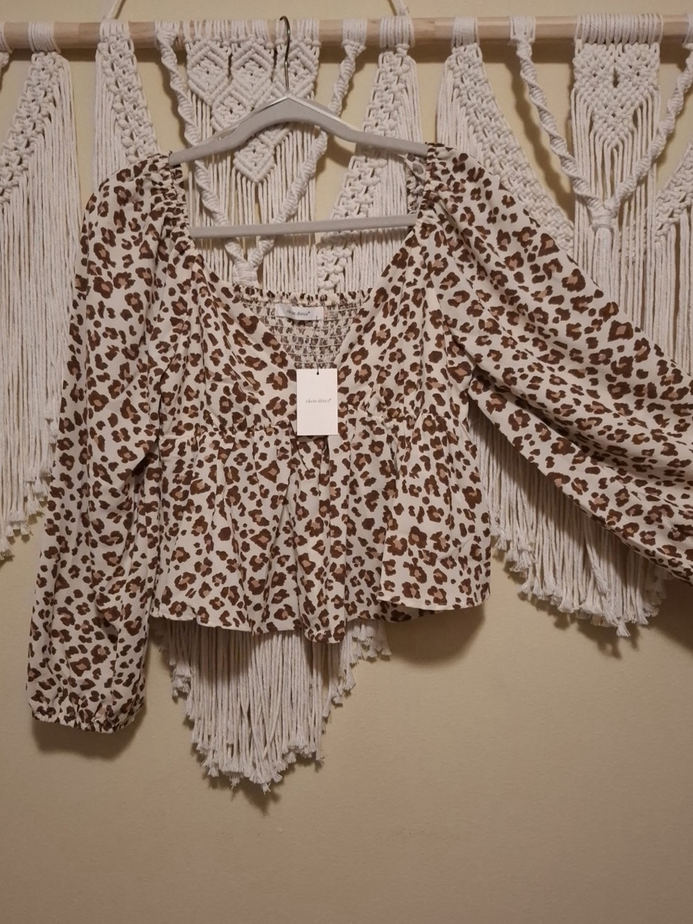 V-Neck leopard print blouse with ruffled bottom